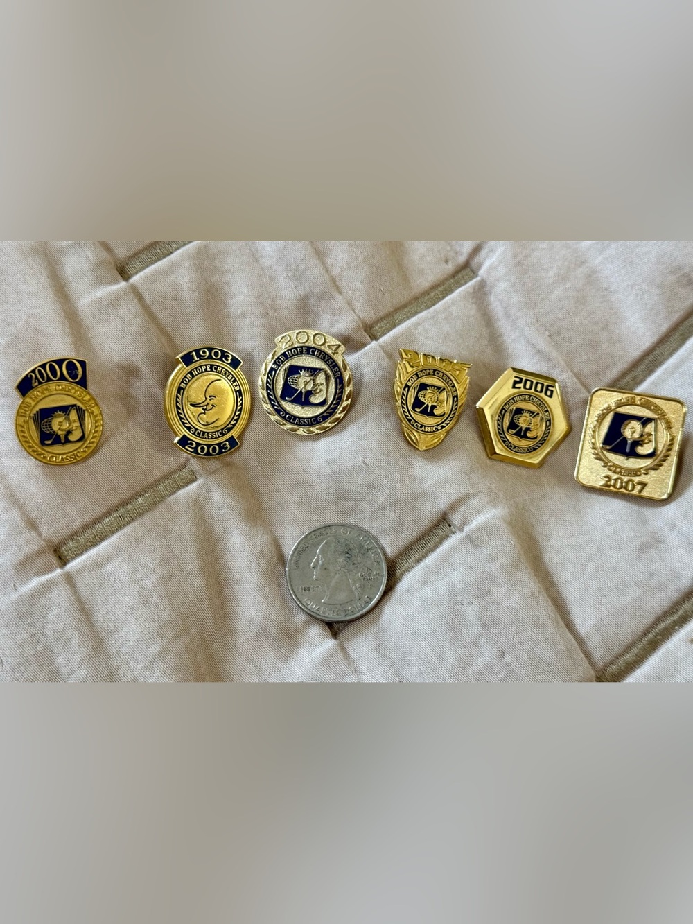 Collection of Bob Hope Chrysler Classic commemorative lapel pins 2000, 2003-2007